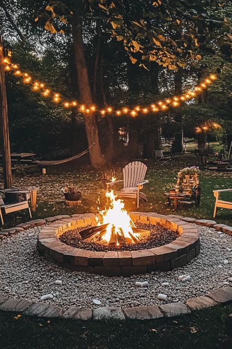 Create a cozy ambiance in your outdoor space with a DIY fire pit. This guide explores the essential steps to design and construct your own fire pit at home, perfect for gathering with friends and family. Learn about various fire pit styles, materials you'll need, and safety tips for installation. Whether you're looking to enhance your backyard experience for summer nights or fall evenings, this DIY project provides details on how to bring warmth and cheer to your backyard with minimal budget. Get ready to enjoy s'mores and starry nights! Outdoor Garden Fire Pit, Fun Fire Pit Ideas, Backyard Burn Pit Ideas, Fire Pit Ideas With Gravel, Outdoor Fire Pit In Ground, Diy Garden Fire Pit, Fire Pit Outside, Lake Fire Pit Ideas, Diy Fire Pit Furniture