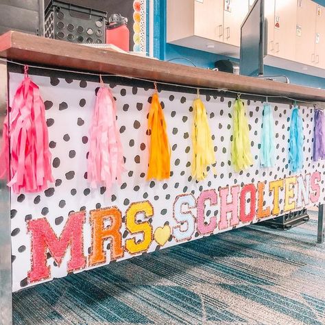 Colorful Classroom Theme High School, Teacher Desk Name Banner, Kindergarten Classroom Teacher Desk, Teacher Desk Garland, You Are Loved Classroom Decor, Cricket Classroom Ideas, Stony Clover Classroom, Teacher Kindergarten Classroom, Decorate Teacher Desk Ideas