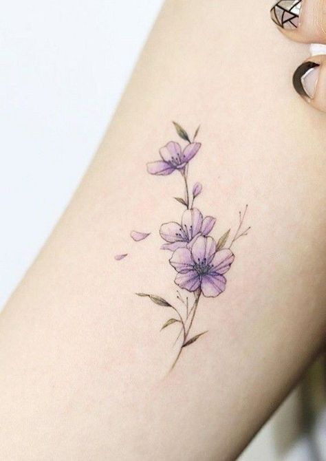 Delicate Black Tattoo, Delicate Violet Flower Tattoo, Violet Wrap Around Tattoo, Violet Flower Tattoo Minimalist, Violet Flower Rib Tattoo, Lilac Flowers Tattoo Design, Violet Flower With Butterfly Tattoo, Purple Vine Tattoo, Malva Flower Tattoo