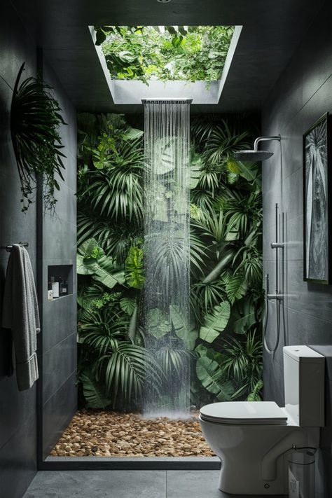 Transform your bathroom into a lush sanctuary with a skylight waterfall shower and tropical plants. Embrace the serenity of a rainforest-inspired design to bring the wild beauty of nature indoors. #RainforestBathroom #NatureInspiredDesign #BathroomRetreat #SkylightShower #TropicalGreenery #BathroomInspo #SereneSpaces #BathroomGoals #NatureVibes #LuxuryBathroomDesign Modern Jungle Bathroom, Walk In Shower With Plants, Bathroom Ideas Plants, Plants In Bathroom Ideas, Rainforest Bathroom Ideas, Rainshower Bathroom, Rainforest Bathroom, Tropical Toilets, Bathroom Hot Tub