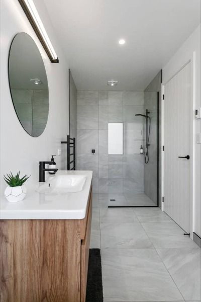 soft grey and white bathroom Bathroom Grey White Wood, Gray White Wood Bathroom, Black White Grey Timber Interior, Modern Bathroom Design Black And Wood, Grey White Bathroom Tiles, Grey And White Tiled Bathroom, Bathroom White Black Wood, Ensuite Bathroom Ideas Black And White, Grey Marble And Wood Bathroom