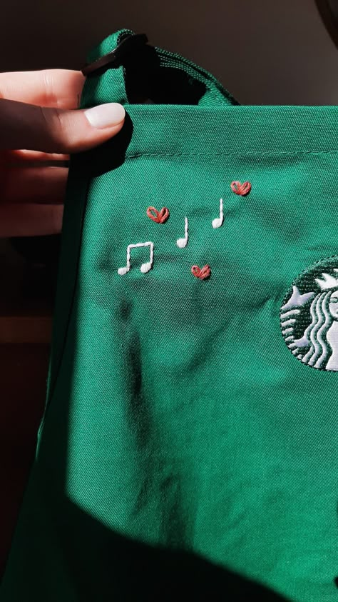 Customized Starbucks apron custom hand embroidery embroidered calligraphy simple minimalist tiny music notes design • jasper rose co Musical Notes Embroidery, Starbucks Apron Embroidery, Music Notes Embroidery, Embroidery On Apron, Hand Embroidery Tshirt Ideas, Tiny Embroidery Ideas Easy, Music Embroidery Designs, Apron Embroidery Ideas, Embroidered Calligraphy