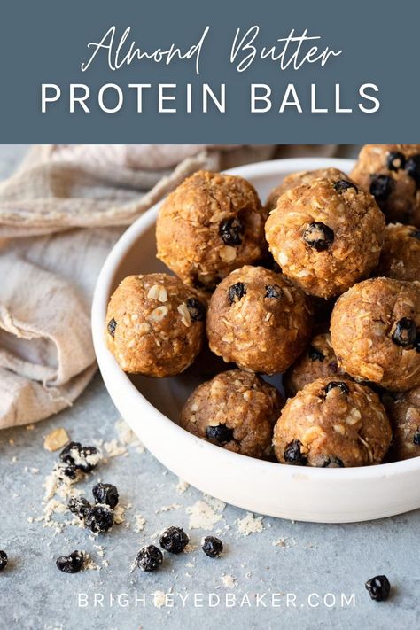 Need a quick, healthy snack option to get you through the week? This easy almond butter protein ball recipe will definitely do the trick. Made with 7 ingredients in just 15 minutes, these little energy balls are simple but tasty, and lack the questionable ingredients you'll find in so many pre-packaged protein bars. These gluten-free protein balls can easily be made dairy-free and vegan as well! Gluten Free Oat Protein Balls, Whole 30 Balls, Almond Butter Protein Bites, Advocare Protein Balls, Almond Butter Protein Cookies, Protein Powder Oatmeal Balls, Gluten Free Power Balls, Peanut Butter Free Protein Balls, But Free Protein Balls