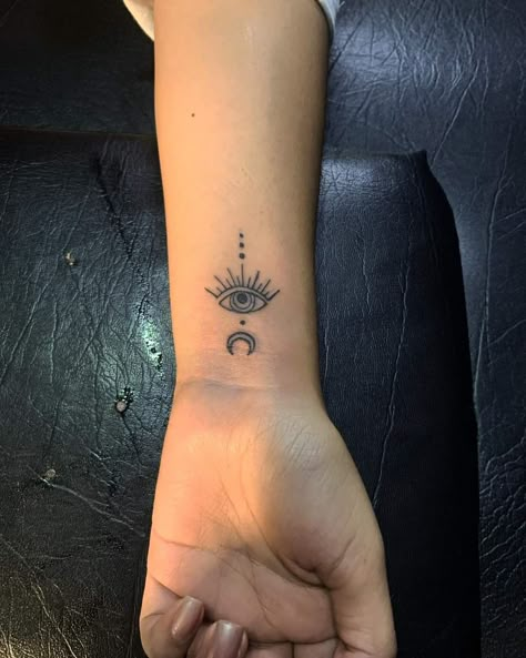 Third Eye Wrist Tattoo, See No Evil Eye Tattoo, Evil Eye Wrist Tattoos For Women, Finger Tattoos Evil Eye, Evil Eye Tattoo For Women Arm, Evil Eye Moon Tattoo, Evil Eye Dream Catcher Tattoo, Intuition Eye Tattoo Meaning, Small Hand Tattoos For Women With Meaning