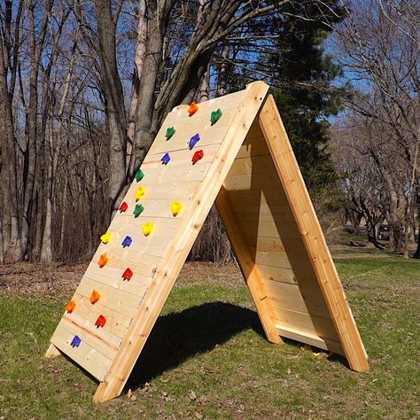 How to Build a Kids Climbing Wall (DIY) | Family Handyman Outdoor Climbing Wall, Diy Climbing Wall, Climbing Wall Kids, Pallet Deck Diy, Pallet Deck, Bouldering Wall, Deck Diy, Kids Climbing, Climbing Holds