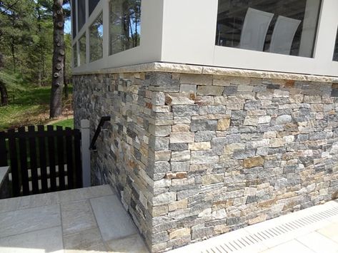 https://www.backyardboss.net/ways-to-hide-house-foundation/ Stone Veneer Exterior, Stone Veneer Wall, Stone Veneer Panels, Landscaping Around House, Hidden House, Exterior Wall Tiles, Natural Stone Veneer, House Foundation, Stone Facade