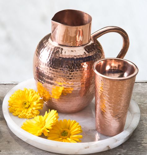 BED SIDE AYURVEDA The benefits of storing water in copper vessels has been part of human history for millennia. The ancient wisdom of ‪#‎Ayurveda‬ suggests that water stored overnight in copper vessels has the ability to balance all the three ‘doshas’ in the body by positively charging the water. The Ganges Jug & Tumbler are ideal for the bedside or workspace, where water is kept for hours at a time. Shop the collection on our #WebBoutique #Nourish #Ayurveda #Copper Copper Tumblers, Copper Pitcher, How To Clean Copper, Copper Kitchen Decor, Storing Water, Copper Jug, Copper Vessel, Copper Tray, Copper Decor