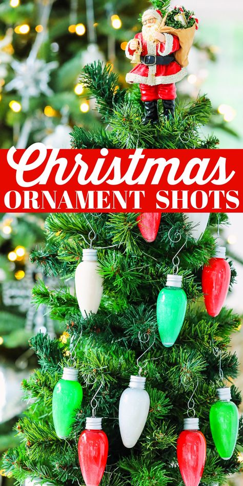 Bright colored red, white and green alcohol shots on a Christmas tree. Christmas Themed Shots Party Ideas, Christmas Shooter Ideas, Ornament Shot Recipe, Christmas Tree Shots, Drinks In Ornaments, Christmas Ornament Shots, Adult Christmas Party Food, Christmas Shots For Adults, Christmas Shot Ideas