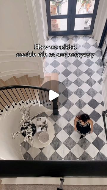 Annie Mescall on Instagram: "How we added this beautiful checkered pattern marble flooring to our entryway! By we, I mean the talented contractors. We add all the original wood removed because we wanted the tile to lay evenly with the wood flooring when it met other rooms. It took a day to remove the wood and to sand down the concrete from the wood glue and application. One thing we did ask the contractor to do was to try his best to lay the tile pattern in the same path. The flooring is a matte finished grey and white marble. In total it took 3 days and cost us $1,200 to the labor and $4,600 for the tile. ⭐️ Tile is from @riadtile 12x12!  Casablanca Carrara & Bardiglio Grey Marble – Honed – 12″x12″ Checkerboard Bundle #tile #checkeredfloor #diyproject #texashomes #marblefloors" Grey Checkered Kitchen Floor, Checkered Marble Floor Entryway, Checkerboard Floor Hallway, Checkerboard Tile Entryway, Entryway Checkered Floor, Checkered Floor Foyer, Foyer Marble Floor Entryway, Grey Checkerboard Floor, Grey And White Checkered Tile Floor