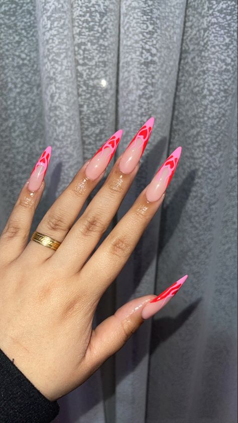 Long Oval Valentines Nails, Valentines Nail Set Almond, Valentines Stilletos Nails, Valentines Nails Acrylic Stiletto, Long Almond Valentines Nails, Long Almond Nails Valentines Day, Stilleto Nails Pink And Black, Heart Flames Nails, Almond Valentines Nails Pink