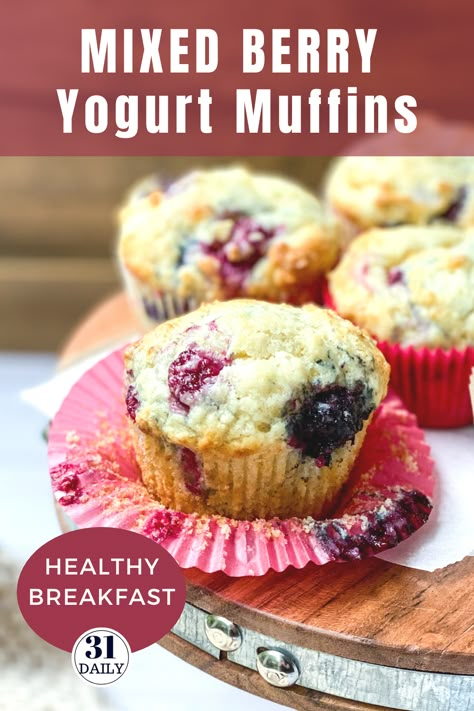 These Mixed Berry Yogurt Muffins are lofty and so moist they almost melt in your mouth. Filled with berries, they are healthy and sweet. This easy recipe is perfect for breakfast, brunch, or a healthy snack. In-season berries are a perfect choice but frozen berries work great too. Be sure to get this recipe at 31daily.com #muffins #berries #mixedberries #brunch #healthysnack #31Daily Yogurt Fruit Muffins, Muffins Mixed Berry, Yogurt Berry Muffins, Berry Breakfast Muffins, Mixed Berry Muffins Easy, Easy Berry Muffins, Greek Yogurt Berry Muffins, Healthy Mixed Berry Muffins, Frozen Berries Muffins