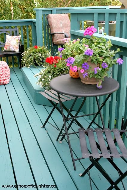 adding color to your deck is a wonderful way to spruce up your home. Blue Deck Paint, Quirky Backyard, Coastal Deck, Colorful Deck, Deck Painting, Green Deck, Outdoor Deck Decorating, Blue Deck, Deck Makeover