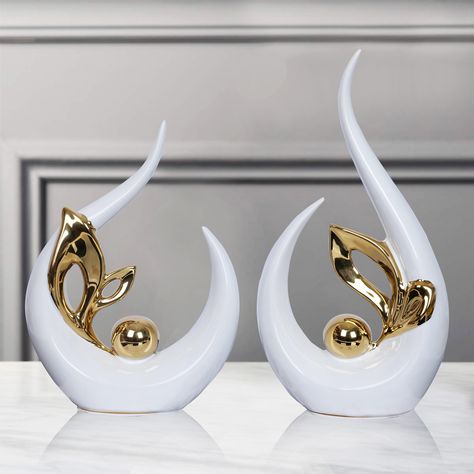 PRICES MAY VARY. Modern Abstract Art Decor size 9.8"H x 5"L x 2.5"W. Small Ceramic Statue 8" high x 6" long x 2.5" wide.Can blend perfectly with most living room decor.Ceramic sculpture can be a perfect art piece for dining room or living room or office decor, coffee table decor [HOME DECOR AESTHETIC]White and Gold Decor made of ceramic material, is an eye-catching piece. After being electroplated and polished, it shows off a mirror-like effect that will never fade [A GIFT EVERYONE LOVES] modern Show Pieces For Living Room, Show Pieces Decor, Show Piece Ideas For Home, Gold Living Room Decor Ideas, White Gold Home Decor, White And Gold Home Decor, Shelf Dining Room, Center Piece For Dining Table, Table Top Decorations