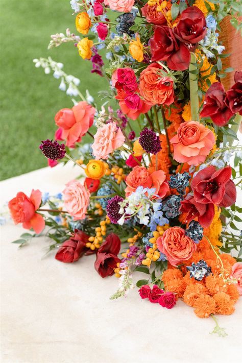 Pink and Orange Wedding Flower Inspiration | The Floral Eclectic My favorite way to add more dimension to an overall warm-colored wedding flower arrangement is to add accents of cooler colors like baby blue and periwinkle. If you’re looking for a similar vibe, pin for inspiration! Red Orange Pink Blue Wedding, Pink Orange Green Wedding Flowers, Orange Spring Flowers, Pink And Orange Wedding Theme Color Schemes, Magenta And Orange Wedding, Orange Pink And Blue Wedding, Blue Orange And Pink Wedding, Sunset Wedding Florals, Pink Orange Wedding Theme