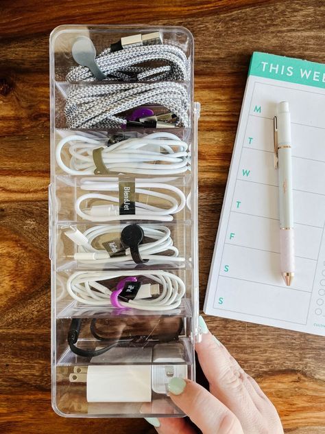 Are your charging cables and cords a tangled mess? Steal these easy ideas for organizing your cord clutter. Extra Cord Storage, Organizing Cables And Cords, Usb Cord Organization, Cord And Cable Organization, How To Organize Electronics, Charging Cord Storage, Organize Electronic Cords, Phone Charger Storage Ideas, How To Organize Chargers