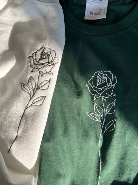 Organic Single Rose T-shirt - Embroidered Designs - Hand Drawn Rose - Sustainable Clothing - Soft Unique Top T shirt #tshirt t-shirt #t_shirt t shirts #tshirts t-shirts #t_shirts T shirt design #tshirtdesign T-shirt designs #t_shirtdesign T shirts designs #tshirtsdesigns 6.211 Shirts Embroidery Design, Cute Shirt Designs Drawing, Embroidery On Shirts Diy, White Rose Embroidery, Black Flower Embroidery, Embroidery Designs For Tshirts, Unique Embroidery Designs Ideas, Embroidery On Tshirt Ideas, Cute Hand Embroidery Designs