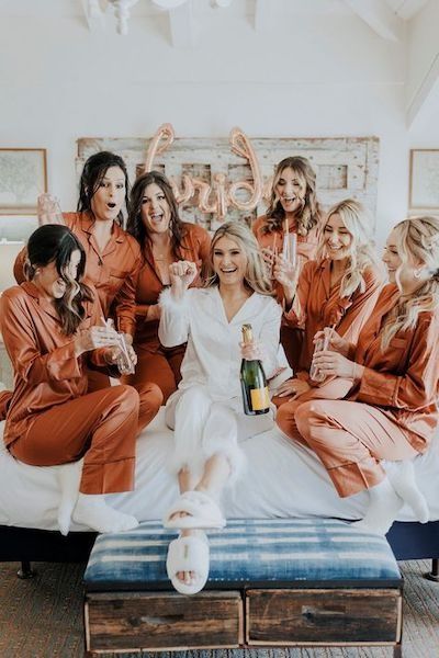 Ask a Real Bride: How Much Can I Ask My Bridesmaids to Spend? Bridesmaid Pjs Pajama Set Fall, Satin Pajamas Bridesmaids, Bride With 6 Bridesmaids, Morning Of Wedding Pajamas, Terracotta Bridesmaid Pjs, Bridal Party Getting Ready Pajamas, Burnt Orange Bridesmaid Pajamas, Bach Party Pjs, Bride And Bridesmaid Matching Pajamas