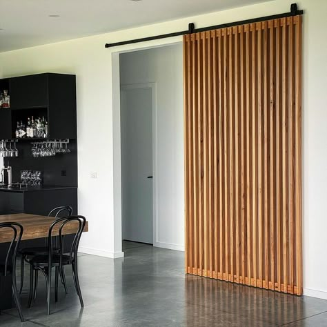 Huuuge Batten Feature Door in Blackbutt installed yesterday for Nicole in her stunning new build. Perfect splash of colour for this space… | Instagram Sliding Slat Doors, Wooden Slider Door Design, Hidden Bedroom Door, Wooden Sliding Door, Sliding Doors Internal, White Staircase, Wooden Sliding Doors, Custom Barn Doors, Slider Door