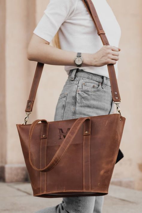 Elevate your style with our custom leather tote bag for women, meticulously handcrafted with rustic charm. This woman shoulder bag is perfect for everyday use, whether for shopping, work, or any adventure, and can be personalized with engraving for a unique touch. Handcrafted Rustic Tote Bag, Custom Leather Bag, Women's Leather Tote, Woman Shoulder Bag, Large Tote, Shopping Bag, Work Bag, Engraved Bag, Artisanal, Personalized Fashion Leather Work Bag Women, Custom Leather Bag, Full Grain Leather Bag, Leather Bag For Women, Leather Bags For Women, Leather Work Bag, Messenger Bag Leather, Womens Messenger Bag, Briefcase Women