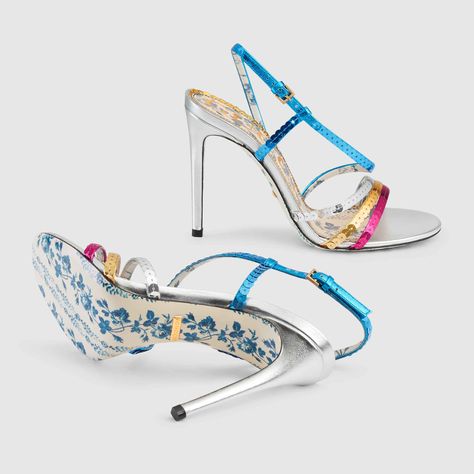 Shop the Metallic leather sandal with sequins by Gucci. The dream-like atmosphere of the Spring Summer 2018 fashion show sets the stage for hypnotic details, fabrics and designs that enrich the mystical world of the collection. This sandal is made up of strips of multicolored metallic leather that criss cross around the foot, trimmed with glittering embroidered sequins. The specialized embroidery ensures that each shoe will be unique, with a one-of-a-kind appearance. Multi Color Shoes, Sandals Gucci, Color Shoes, Beautiful High Heels, Cute Heels, Block Heel Sandals, Stiletto Pumps, Carrie Bradshaw, Fashion High Heels