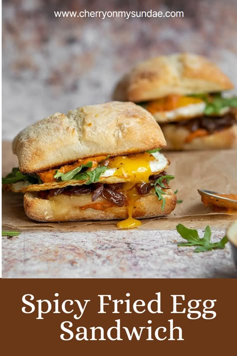 Start the day the best possible way, with this spicy fried egg sandwich topped with caramelized onions, cheddar, and a special spicy sauce. #breakfastsandwich #eggsandwich #eggs #brunchideas #breakfastrecipe #sandwichrecipe #vegetarianbreakfast Sandwich Ideas For Breakfast, Spicy Egg Sandwich, Ciabatta Egg Sandwich, Breakfast Sandwich Brioche, Perfect Egg Sandwich, Ciabatta Sandwich Recipes Breakfast, Fancy Breakfast Sandwich, Special Sandwich Ideas, Fried Egg Breakfast Ideas