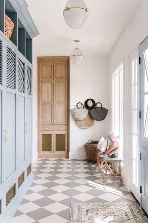 How beautiful is this mudroom? We love the gray and white checkered floor tile paired with the light blue mudroom cubbies! Metal grated front cabinets + mudroom storage ideas + dutch door into mudroom | Tiek Design Group Checkered Floor Tile, Mushroom Style, Interior Remodeling, Draper Utah, Checkered Floor, Mudroom Flooring, Interior Design Website, Mudroom Ideas, Mudroom Design