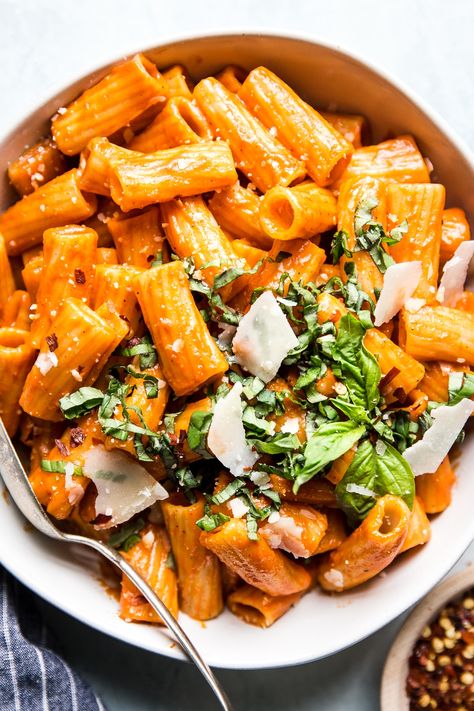 Creamy Roasted Red Pepper Rigatoni Pasta by The Modern Proper. With just five ingredients, dinner doesn’t get easier or more delicious than this creamy roasted red pepper rigatoni pasta. If you’ve got ten minutes and can open a jar, you can make this tonight. Roasted Red Pepper Rigatoni, Red Pepper Rigatoni, Red Pepper Pasta Sauce, Roasted Red Pepper Pasta, The Modern Proper, Modern Proper, Red Pepper Pasta, Roasted Red Pepper Sauce, Rigatoni Pasta