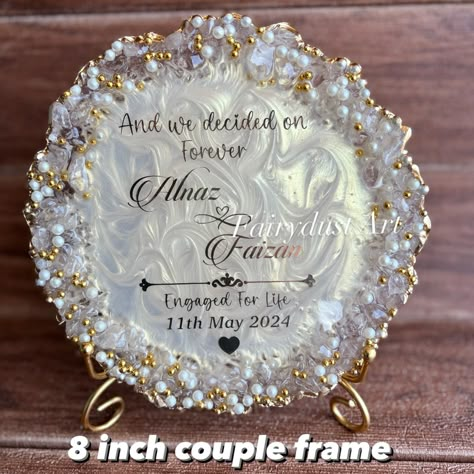 Couple frames are a trendy and aesthetic gift to decorate the room . Dm to order yours @fairydustart_16 . [ couple gift, couple gifts, anniversary gift, anniversary gifts, wedding gift, wedding gifts, anniversary gift] Resin Art For Anniversary Gift, Resin Frames For Couples, Resin Art Wedding Gift, Engagement Anniversary Gift Ideas, Resin Frame Ideas, Resin Art Business, Engagement Gift Ideas For Couples, Raisin Art, Wedding Gift Ideas For Couple