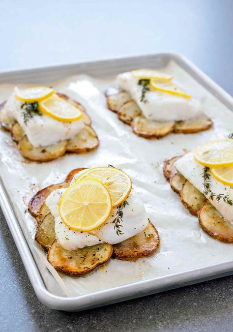 This elegant one-pan meal of lemon roast fish with potatoes is fancy enough for guests but completely doable on a weeknight. #weeknight #fishrecipes #onepan Fish With Potatoes, Roasted Cod, Roast Fish, Lemon Herb, Fish Dishes, Edamame, Fish And Seafood, Fish Recipes, Seafood Recipes