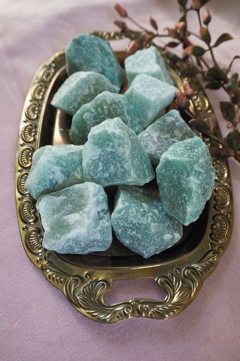 Aventurine, a variety of quartz, is known for its shimmering effect caused by tiny mineral inclusions. It is often green but can also be found in shades of blue, brown, orange, and red. Aventurine is associated with prosperity, abundance, and luck. It is also believed to promote emotional well-being, strengthen personal growth, and aid physical healing and vitality. FOR MORE INFORMATOIN PLEASE VISIT OUR WEBSITE . Website Link in Profile Aventurine Aesthetic, Cristal Stone, Abundance Crystals, Red Aventurine, Raw Turquoise, Green Aventurine Crystal, Crystal Aesthetic, Physical Healing, Aventurine Crystal