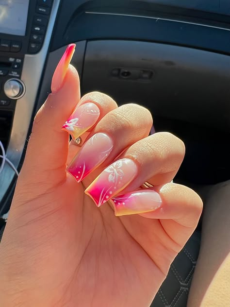 yellow french with airbrushed pink and white flowers 🤍 Pink And Yellow Ombre Nails Acrylic, Pink And Yellow Ombré Nails, Pink To Yellow Ombre Nails, Pink White And Orange Nails, Yellow And Pink Ombre Nails, Japanese Nail Art Summer, Pink And Yellow Summer Nails, Summer Nails Colourful, Aura Nails With Hibiscus Flowers