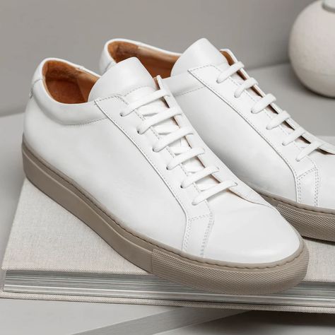 In the ever-evolving world of men's fashion, there's a timeless piece that continues to hold its ground with effortless style and versatility – men's white leather sneakers. These iconic footwear choices have transcended generations and fashion eras, maintaining their status as a wardrobe staple for the modern man. In this exploration of men's white leather sneakers, we delve into a curated selection of premium options that embody craftsmanship, comfort, and enduring design. White Leather Sneakers Men, Simple Sneakers, Fashion Eras, Minimalist Sneakers, Leather Sneakers Men, Sneakers Dress, New Trainers, Vegan Sneakers, Designer Footwear