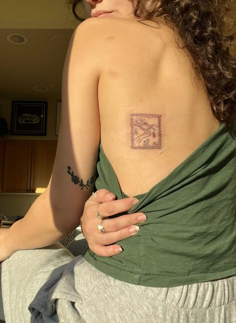 Coolest Tattoo Placements, Word Placement Tattoos Arm, Tattoo Stamp Sleeve, Subtle Tattoo Placement Women, Costa Rica Stamp Tattoo, Stamp Tattoo Placement Ideas, German Stamp Tattoo, Back Stamp Tattoo, Feminine Travel Tattoo