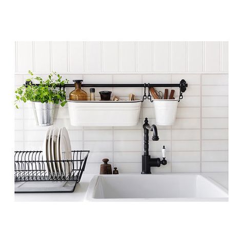 Make the most of a tiny counter with a wall-mounted sink caddy. | 17 Ways To Squeeze A Little Extra Storage Out Of A Tiny Kitchen Fintorp Ikea, Above The Kitchen Sink, Koti Diy, Clutter Free Kitchen, Apartment Needs, Interior Design Minimalist, Small Apartment Kitchen, Small Kitchen Storage, Decor Studio