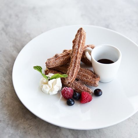 A churro with all our favorite accoutrements: berries, cream and chocolate. Gourmet Desserts Presentation, Fancy Desserts Presentation, Fancy Food Presentation, Chocolate Tarts, Easy Casserole Dishes, Fine Dining Desserts, Plated Dessert, Dessert Presentation, Dessert Plating