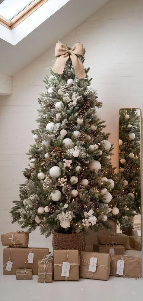 Cozy Woodland Christmas Tree Themes for a Rustic Look Christmas Tree Ideas Modern Farmhouse, Christmas Tree With Flocked Ornaments, Frosty Christmas Tree Decorating Ideas, Modern Tree Topper Ideas, Elegant Neutral Christmas Tree, Christmas Tree Elegant Beautiful, Fluffy Christmas Trees, Modern Coastal Christmas Tree, Beige And White Christmas Tree