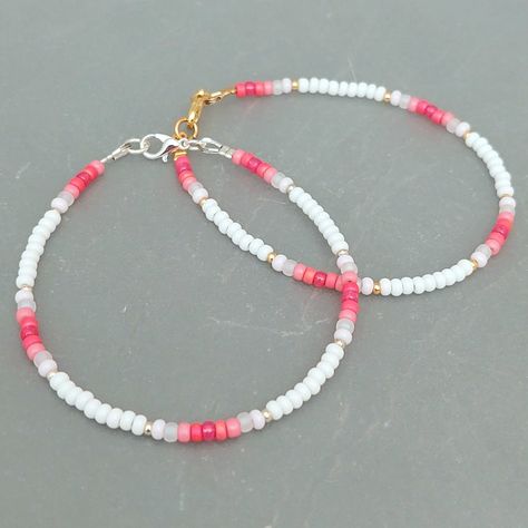 This pink summer seed bead bracelet has been lovingly made using good quality colourful 3mm glass Miyuki and Preciosa seed beads in pinks and white. Available with either 2mm silver or gold Miyuki seed beads to highlight. Threaded on strong stainless steel 7 strand Tiger Tail wire and finished with silver / gold plated wire guardians, a trigger clasp and optional extender chain. Matching necklace available on request. Matching Anklet available on request. More colours and designs can be found at: https://www.etsy.com/uk/shop/CraftHutCornwall BRACELET LENGTHS 6 1/2" Small 7"       Ladies - Small 7 1/2" Ladies - Standard (this is the most common size and generally the size most bracelets are made) 8"       Ladies - Standard Large / Mens - Standard 8 1/2" Ladies - Large / Mens - Standard Larg Cute Handmade Bracelets Beads, Beaded Bracelets And Necklaces, Seed Bead Bracelets For Men, Small Beaded Bracelets Ideas, Bracelet Ideas With Small Beads, Small Glass Bead Bracelet Ideas, Matching Seed Bead Bracelets, 3mm Bead Bracelet, Mini Bead Bracelet Ideas