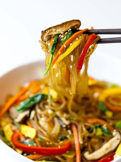 A simple, easy recipe for Japchae, also known as Korean glass noodles with stir fried vegetables. It's made with sweet potato starch noodles, colorful vegetables and tossed in a savory sauce! #japchae #Koreannoodles #glassnoodles #drivemehungry | drivemehungry.com Sweet Potato Glass Noodles Recipe, Japchae Noodles, Korean Noodle Dishes, Stir Fry Glass Noodles, Glass Noodles Recipe, Korean Glass Noodles, Glass Noodle Salad, Salad Add Ins, Broiled Chicken Breast