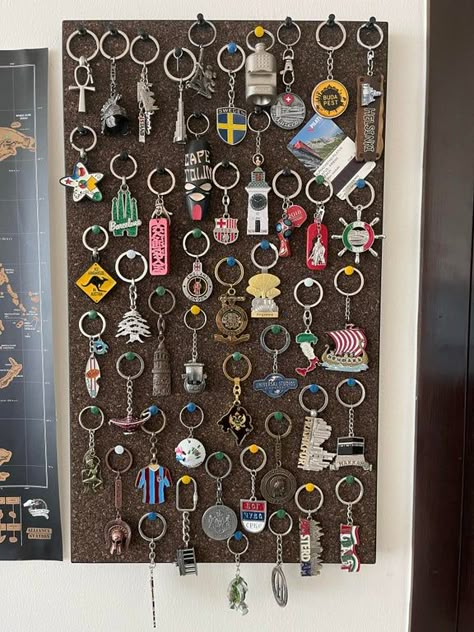 Keychains collection from my travels, I thought this is the best way to display them : travel Keychain Souvenir Ideas, Keychain Decor, Travel Magnets Display, Travel Ornament Display, Souvenir Organization Ideas, Travel Souvenirs Display Wall Shelves, Souvenir Wall Display, Keychain Storage, Keyring Collection Display