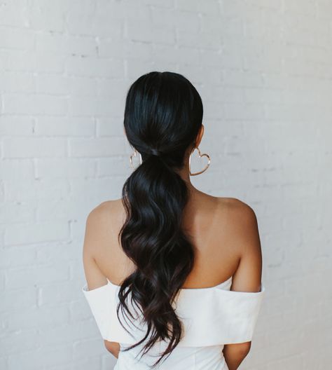 Low ponytail with loose waves Loose Curl Ponytail Wedding, Low Pony With Front Pieces, Wedding Day Ponytail With Veil, Wedding Reception Ponytail, Bridal Ponytail Brown Hair, Bridal Ponytail Dark Hair, Brunette Ponytail Hairstyles, Clean Bridesmaid Hair, Bridal Low Ponytail Hairstyles