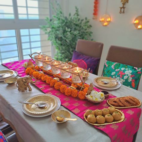 This dining area becomes a canvas that showcases the rich heritage and customs of India. A splash of royal colors adorns the table, reflecting the opulence and grandeur of Indian traditions. Intricately designed decor in golden accents, such as candle holders, placemats, or decorative plates, add a touch of glamour and elegance to the space. An array of beautiful candles and flowers grace the dining table, completing the immersive experience. Cr: mera_ashiyana2022 Dining Table Indian, Dining Table Decor Indian, Buy Dining Table, Candles And Flowers, Textiles Ideas, Gcse Textiles, Dining Table Sets, Dining Room Design Ideas, Dining Table And Chairs