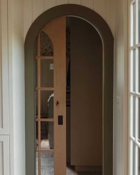 We’re here to remind you to never settle for boring pocket doors ✨ Here, we opted for an arched wood + glass pocket door tied with an arched opening + chunky painted green casings. Tucked away at the corner of the kitchen, the homeowners get to see a peek of the colorful floral wallpaper in their mudroom/laundry room on the daily. 💛 . . . . #mudroomgoals #currentdesignsituation #purposeinstyle #apartmenttherapy #patternwallpaper #customcabinetry #minneapolisdesign #mudroom #pocketdoors #spott... Wide Pocket Door, Pocket Door For Bathroom, Arched Pocket Door, Colorful Floral Wallpaper, Arched Opening, Glass Pocket Door, House Accents, Mudroom Laundry, Mudroom Laundry Room