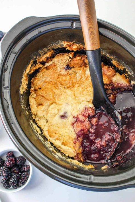 This slow cooker mixed berry cobbler might be the easiest and best tasting cobbler you’ve ever made. It’s an incredibly rich and decadent dessert recipe that lets the slow cooker do all the work for you! Crockpot Berry Cobbler, Slow Cooker Cobbler, Crockpot Cobbler, Fruit Cobbler Recipe, Cobbler Cake, Cake Mix Cobbler, Crockpot Cake, Mixed Berry Cobbler, Crockpot Dessert