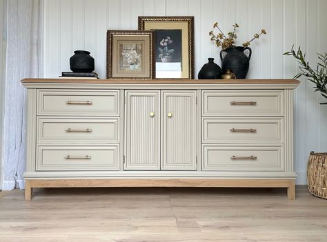 || AVAILABLE || Vintage solid Oak triple dresser in a beautiful mushroom taupe and light oak accents! Champagne bronze modern hardware to complement the beautiful moldings, which completes the look! This is a huge dresser measuring about 77” in length! Plenty of space with nine, dovetailed drawers! Would definitely add a neutral, light and airy accent piece to any space! Scroll to see a “before” picture as well! If you’re interested in purchasing this, please send a message! Locatio... Trending Home Decor For 2024, Taupe Dresser, Dresser And Tv, Living Room Dresser, Dining Room Dresser, Dresser In Living Room, Furniture Makeover Inspiration, Triple Dresser, Furniture Upcycle