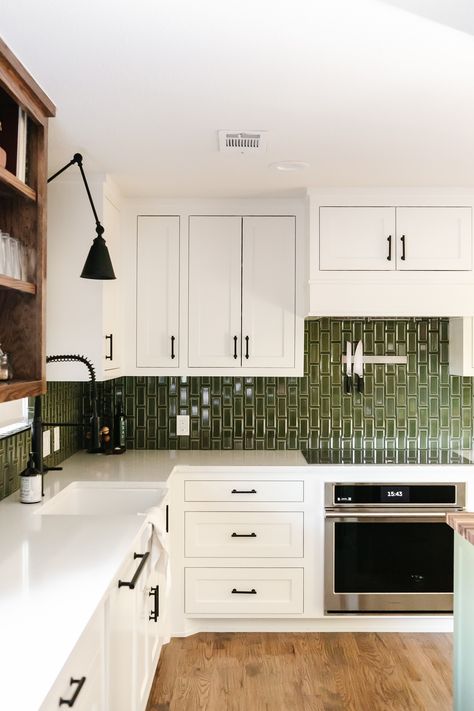 This modern farmhouse kitchen at our Summer Lane project was transformed by this high-gloss green subway tile. The pop of color in the backsplash is such a beautiful contrast to the white cabinets, warm wood open shelving, and black cabinet hardware! Wood Open Shelving, Green Kitchen Backsplash, Backsplash With White Cabinets, Green Subway Tile, Green Backsplash, Calm Nature, Black Cabinet Hardware, Green Tile, Kitchen Tile