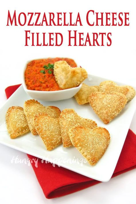 30 minutes · Serves 12 · Serve these heart-shaped appetizers for Valentine's Day, on a special date night, or at a bridal shower. Each pie crust heart is filled with Mozzarella Cheese and is served with roasted red pepper… More Galantines Appetizers, Heart Shaped Grilled Cheese, Finger Food Valentines Day, Valentines Day Sandwiches, Valentines Treats Savory, Galentines Dinner Food Ideas, Savory Valentine Treats, Savory Valentines Day Snacks, Savoury Valentines Snacks