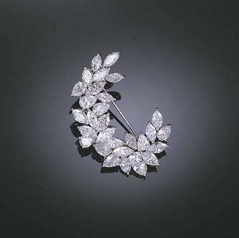 A DIAMOND BROOCH    Designed as a marquise-cut and pear-shaped diamond scroll, mounted in 18k white gold, 4.8 cm. wide Diamond Brooches, Brooch Diamond, Sparkly Jewelry, Collar Pins, Diamond Jewelry Designs, Diamond Brooch, Brooch Jewelry, Exclusive Jewelry, Pear Shaped Diamond