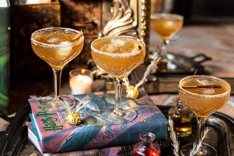 The Golden Snitch Cocktail | halfbakedharvest.com #harrypotter #cocktails #easy #fall Harry Potter Cocktails, Company Decor, Winter Beverages, Cocktails Easy, The Golden Snitch, Whisky Cocktail, Fall Cocktail, Drink Inspiration, Sweet Cocktails