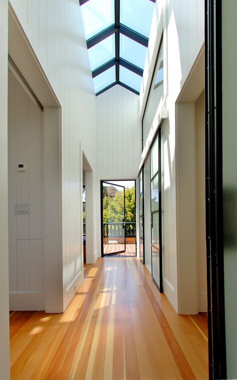 Steel-Framed Skylight in this Upper Level Hallway by Jeff King & Company Skylight Ideas, Skylight Design, Sky Lights, Interior Design Career, Hallway Designs, Hallway Design, Sky Light, Long Hallway, Hal Decor