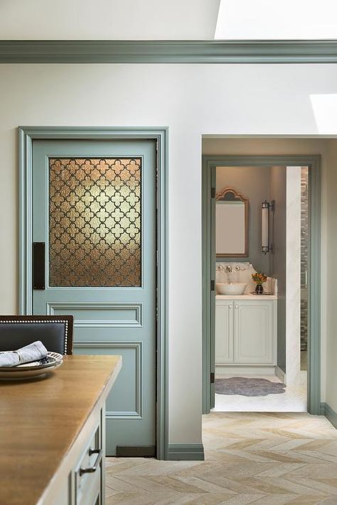 Gray kitchen pantry door with a frosted glass quatrefoil panel in a transitional kitchen with blue-gray crown molding and tan herringbone floor tiles. Frosted Glass Pantry Door, Kitchen Pantry Doors, Glass Pantry Door, Glass Pantry, Frosted Glass Door, Pantry Doors, Glass Panel Door, Door Inspiration, Herringbone Floor